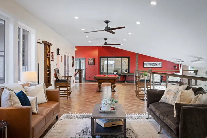Living room with a ceiling fan, light wood finished floors, pool table, recessed lighting, and lofted ceiling