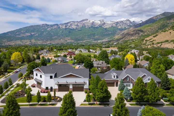 Aerial perspective of suburban area featuring a mountain backdrop