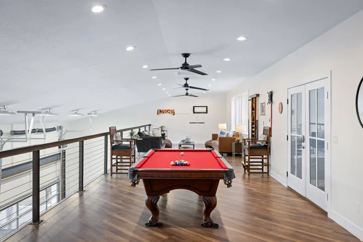 Game room with a ceiling fan, lofted ceiling, dark wood-style flooring, pool table, and recessed lighting