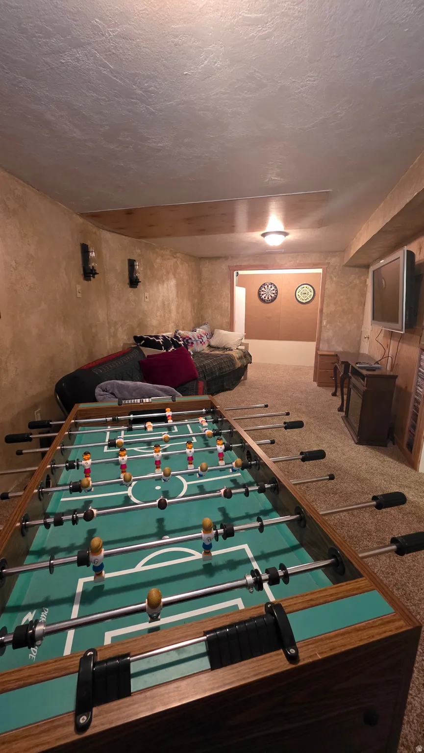 Playroom with a textured ceiling