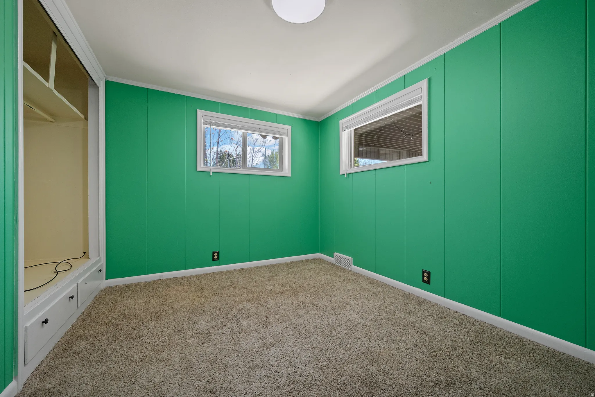 Unfurnished bedroom featuring carpet floors and ornamental molding