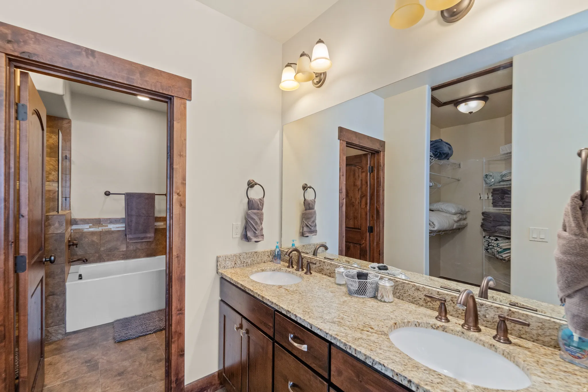 Full bathroom with double vanity and a bathtub