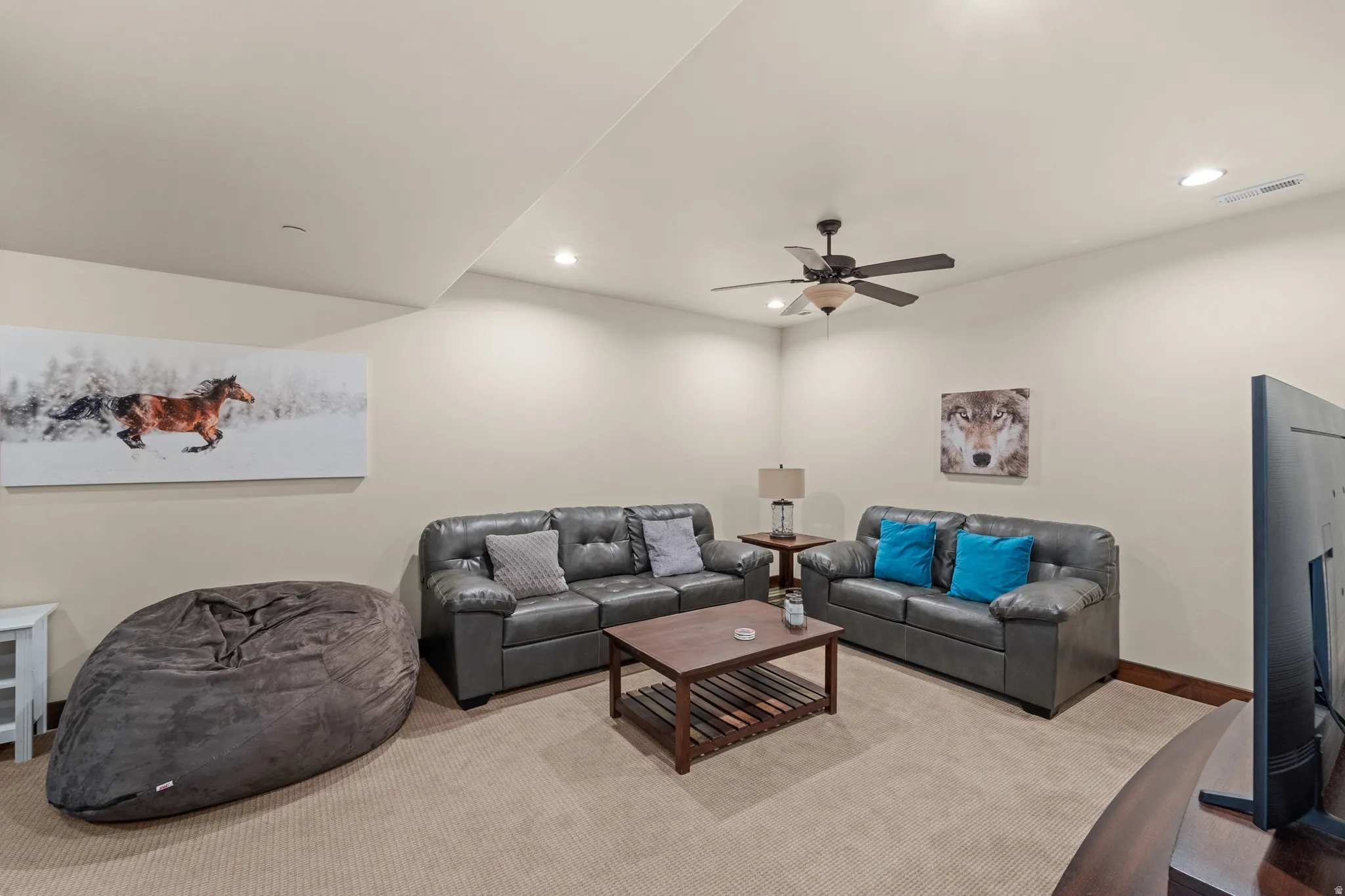 Living area featuring recessed lighting, ceiling fan, and carpet floors
