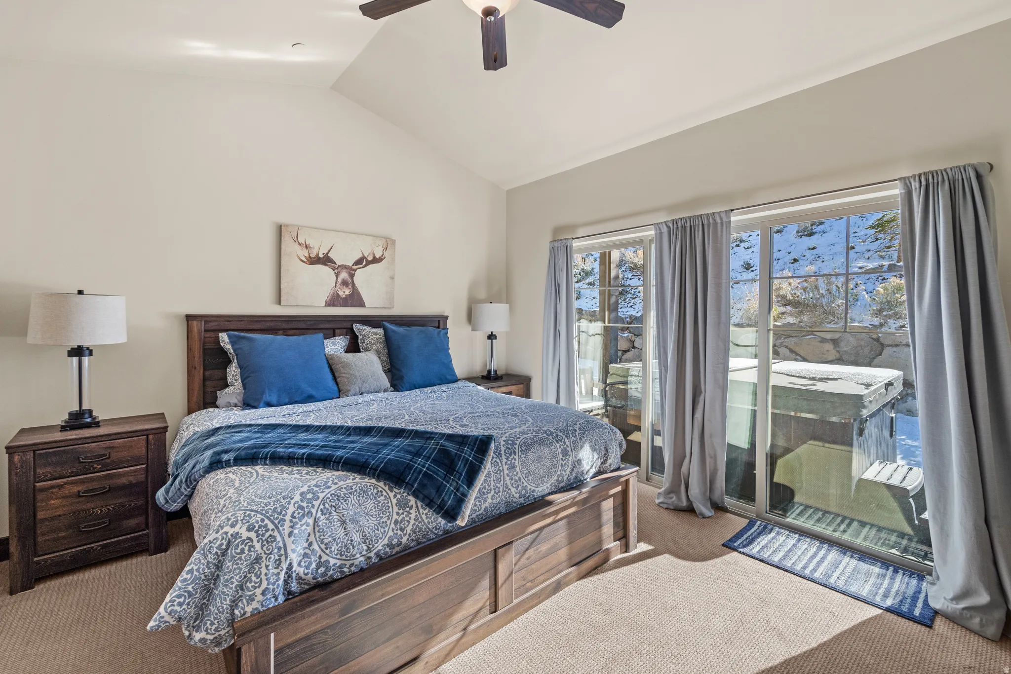 Bedroom featuring carpet, lofted ceiling, and ceiling fan
