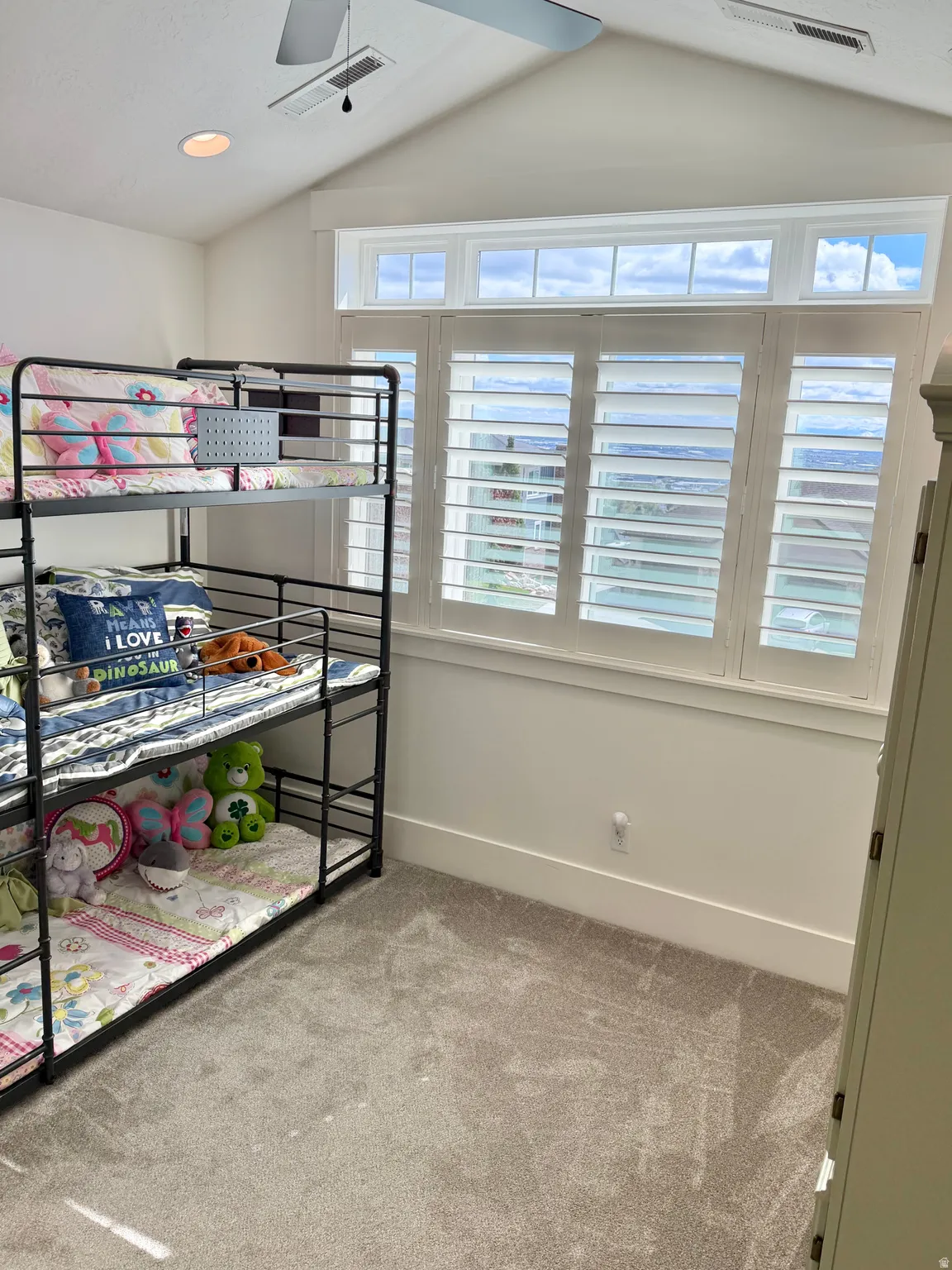 Unfurnished bedroom with light colored carpet, recessed lighting, and a ceiling fan