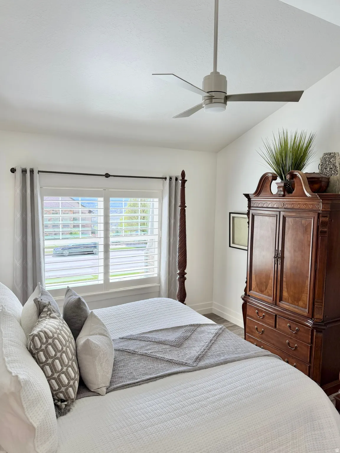 Bedroom featuring a ceiling fan and vaulted ceiling