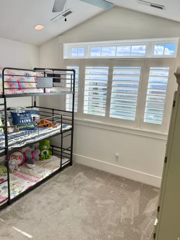 Unfurnished bedroom with light colored carpet, recessed lighting, and a ceiling fan