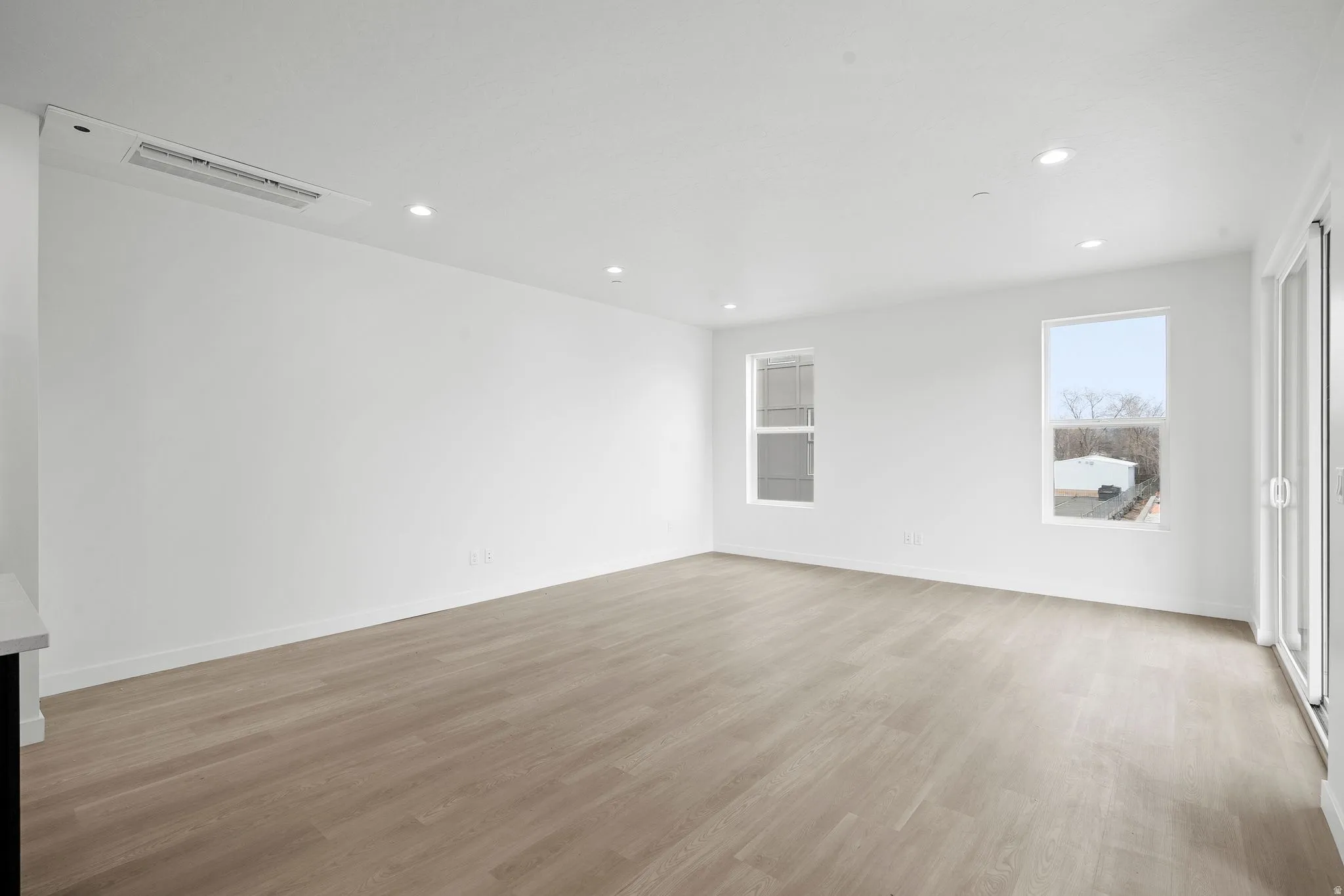 Unfurnished room with recessed lighting and light wood-style flooring