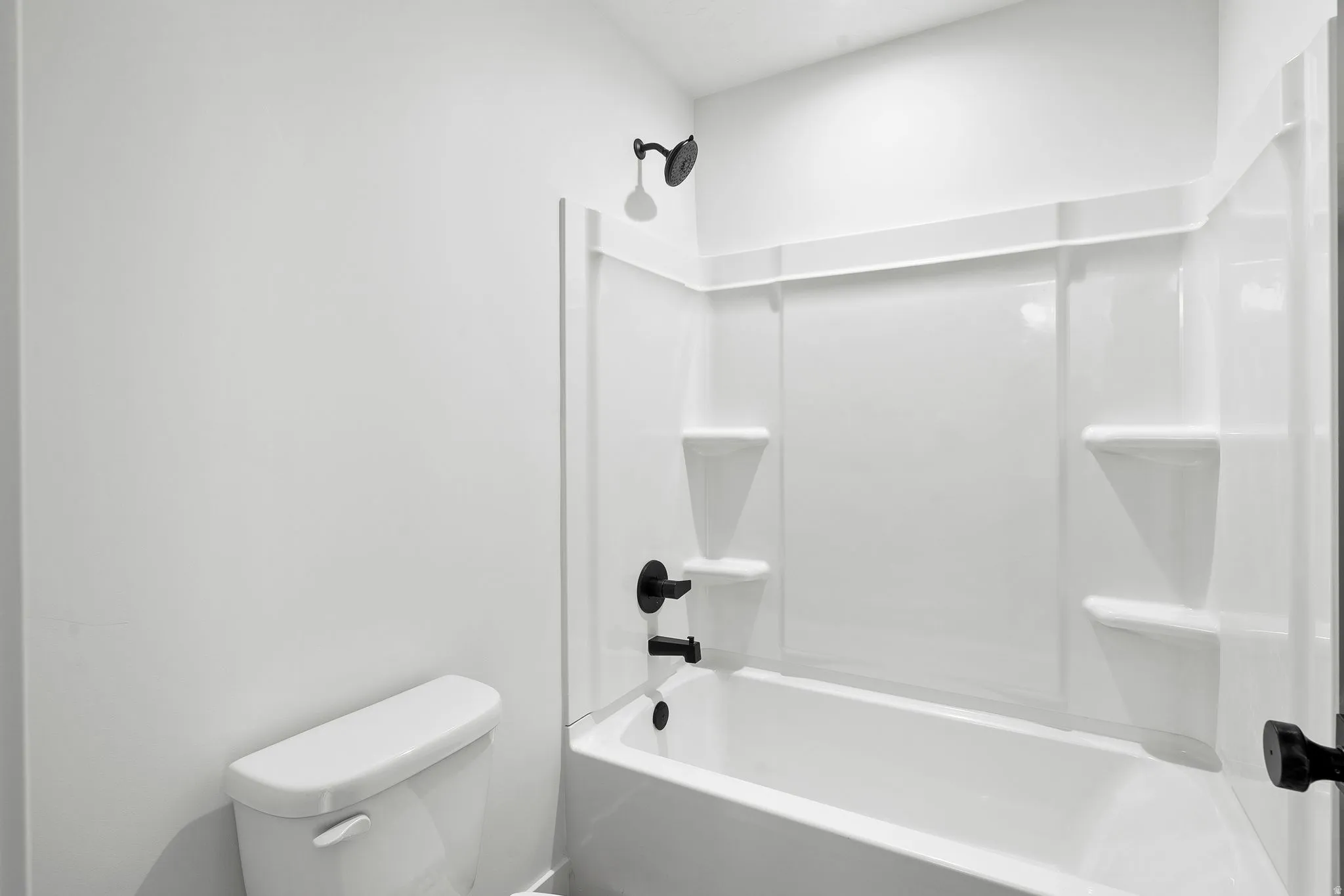 Bathroom with toilet and shower / washtub combination