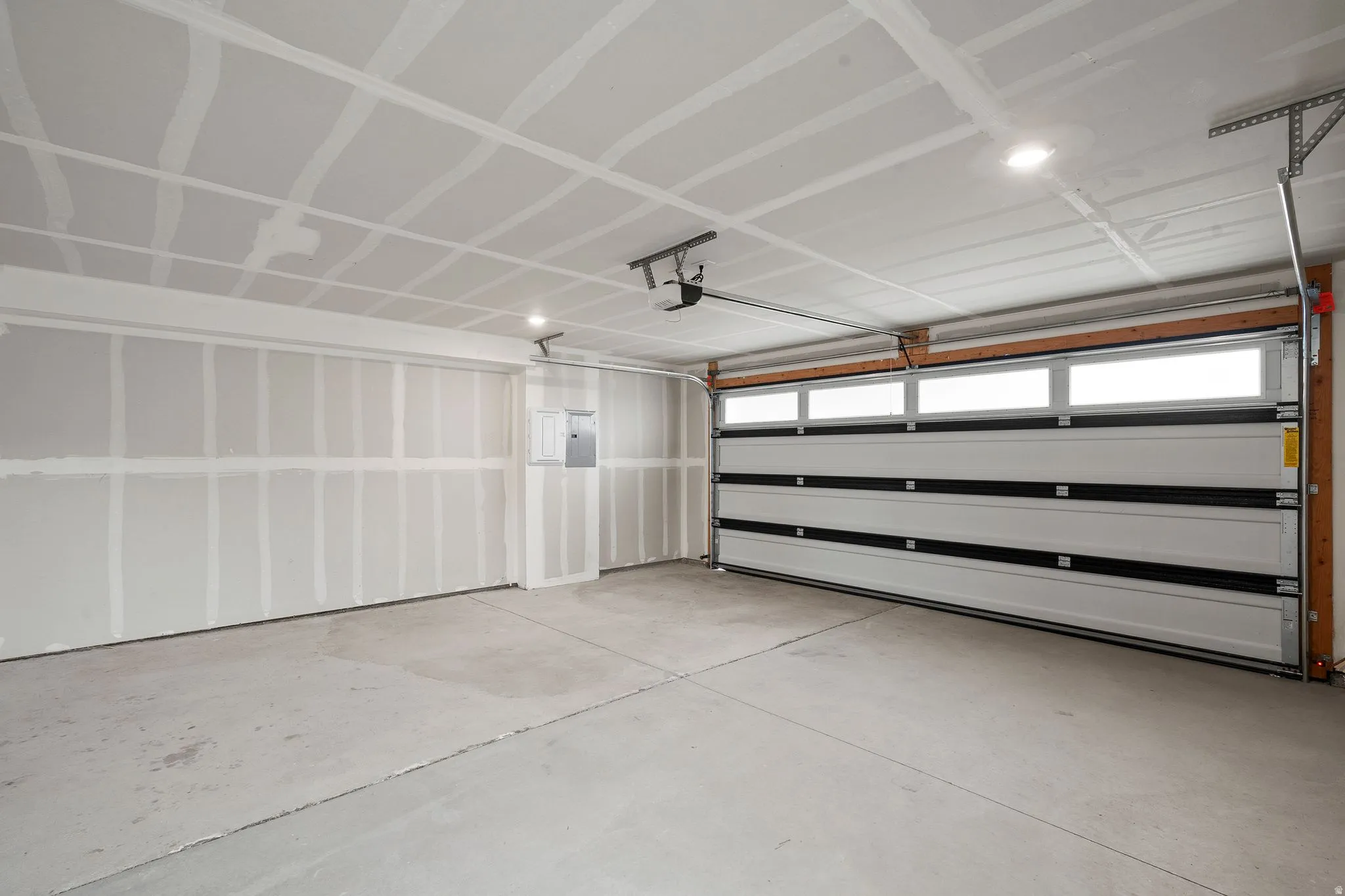 Garage featuring electric panel