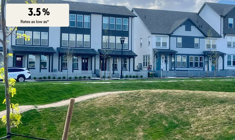 View of front facade with a front lawn and a shingled roof