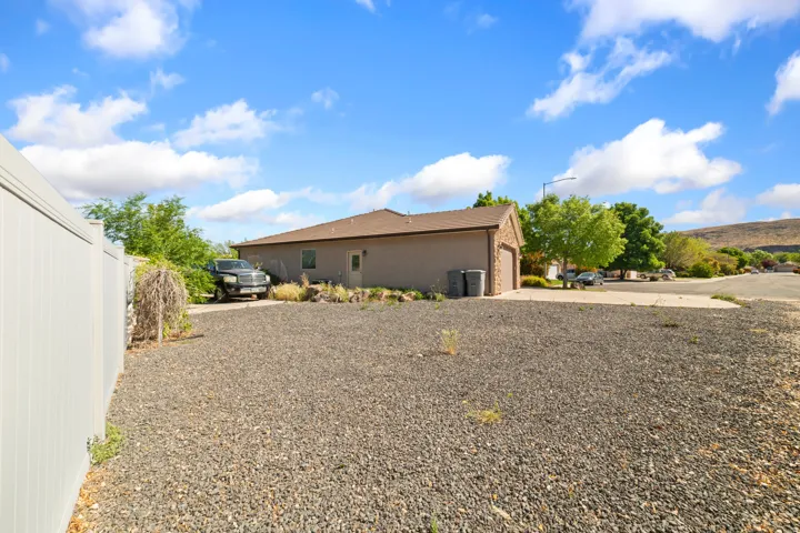View of side of property featuring driveway