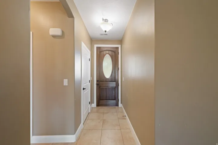 Entryway featuring tile patterned flooring and arched walkways