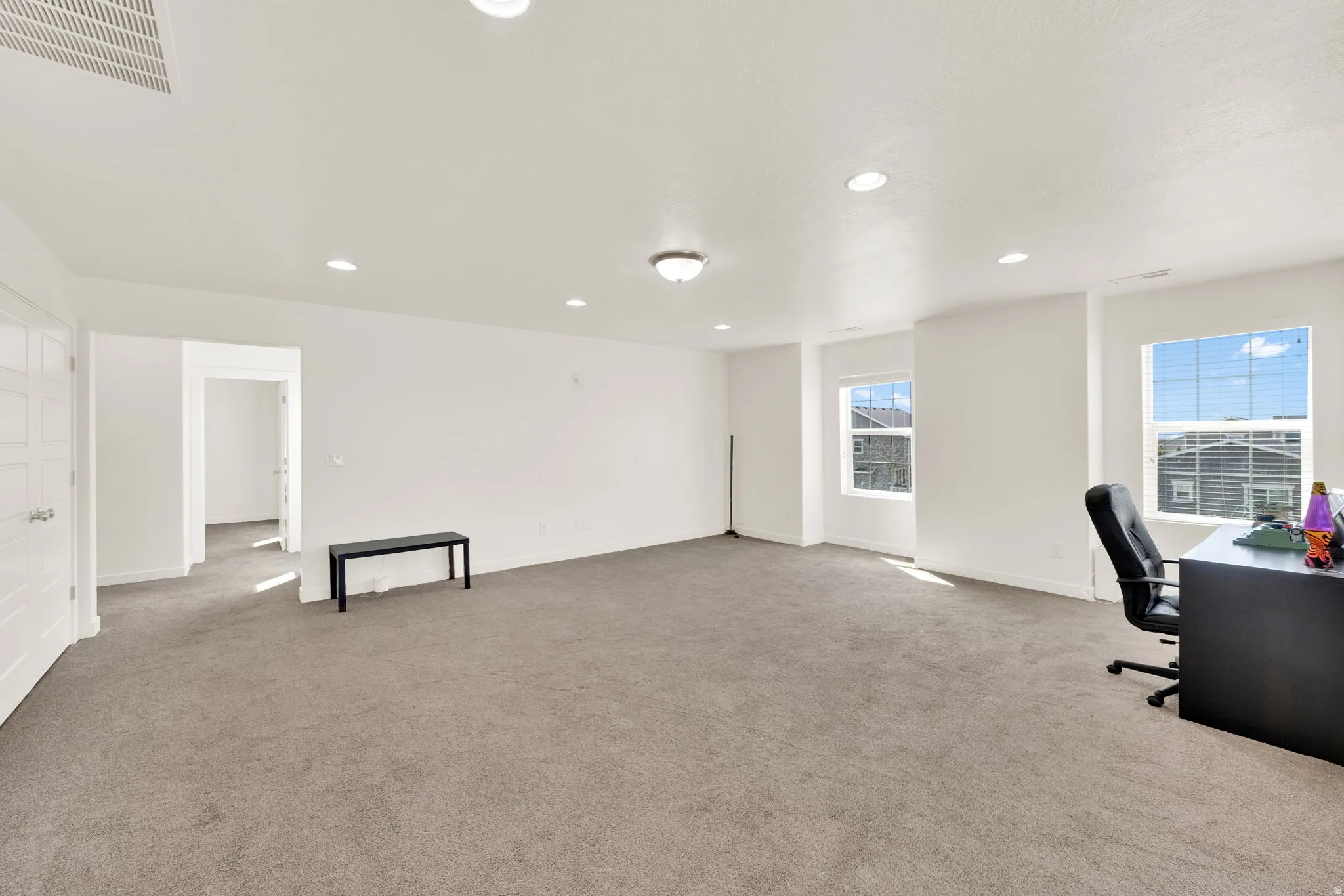 Unfurnished office featuring recessed lighting and light colored carpet