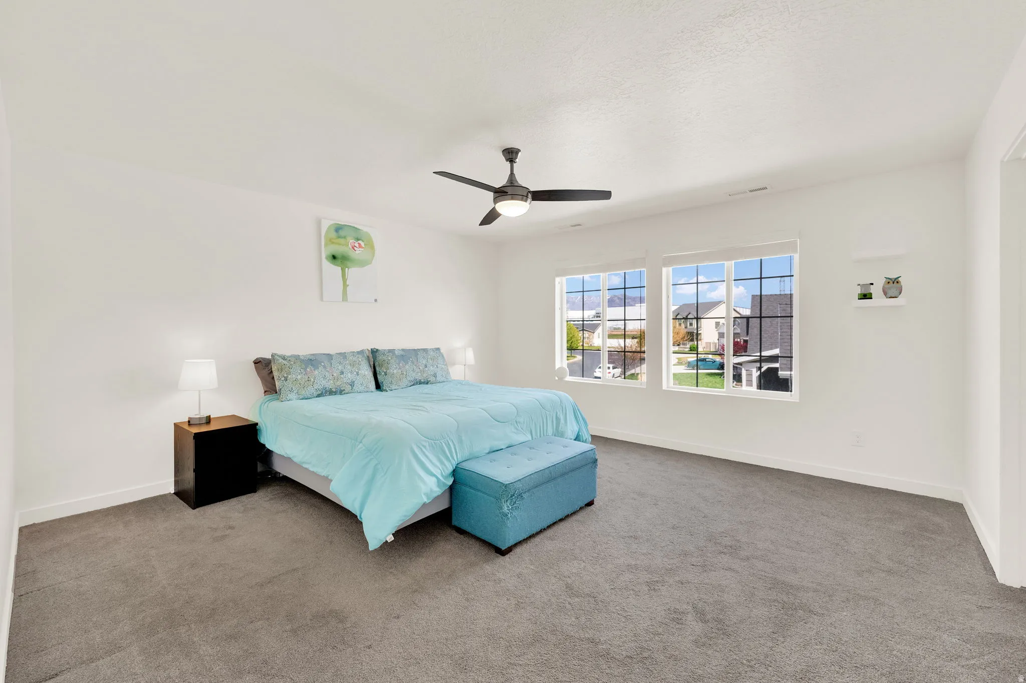 Bedroom featuring carpet flooring and a ceiling fan