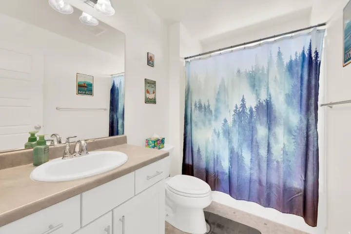 Full bathroom with vanity and toilet
