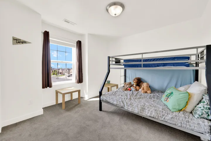 Bedroom with carpet and baseboards