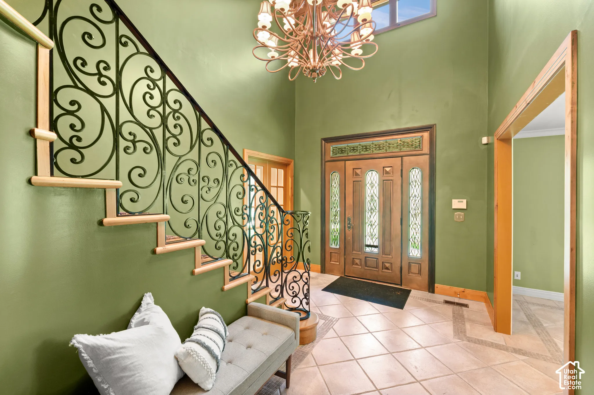 Foyer entrance with ornate railing.