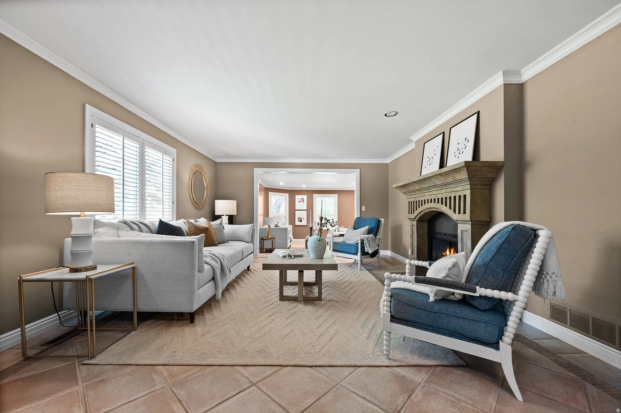 Living area at front of home, featuring recessed lighting and fireplace