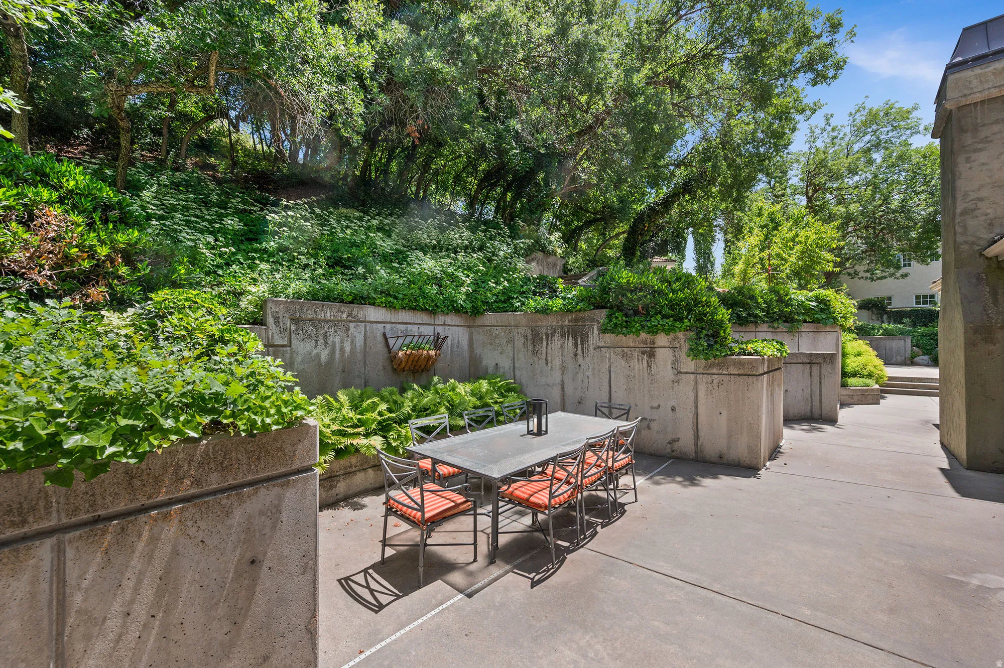 Fenced backyard with outdoor dining area and a patio