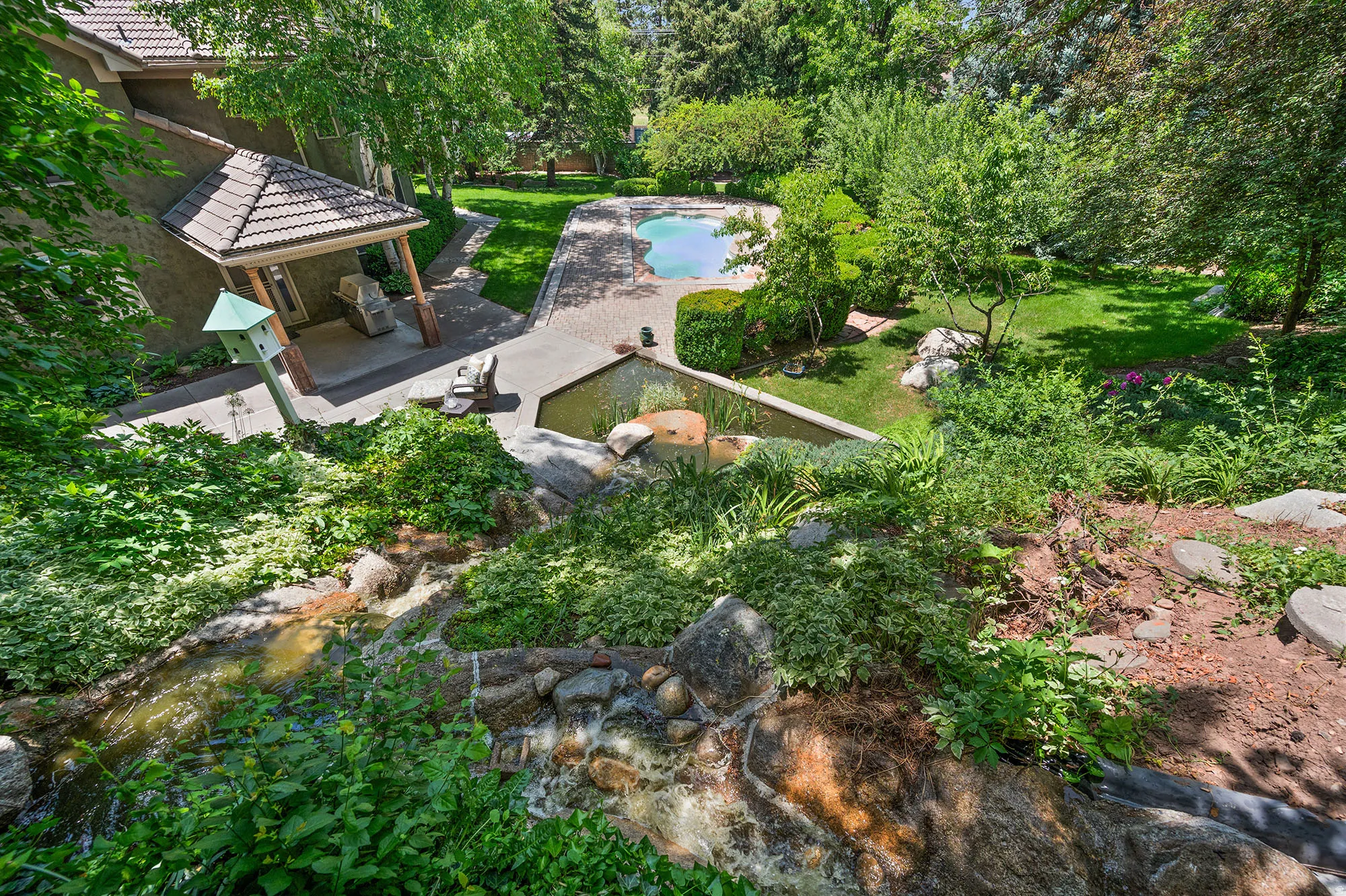 View from upper yard featuring a patio area,  and an outdoor pool