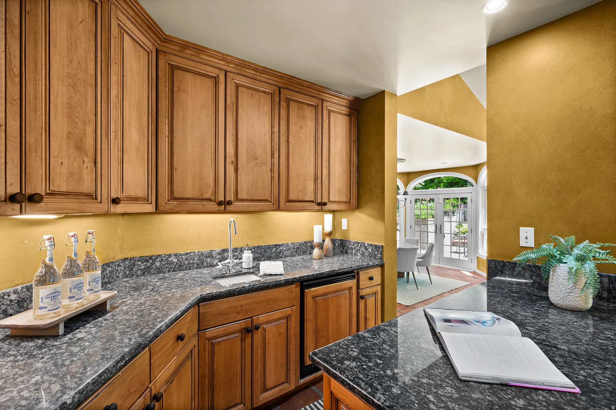 Bar next to theater chairs and TV.