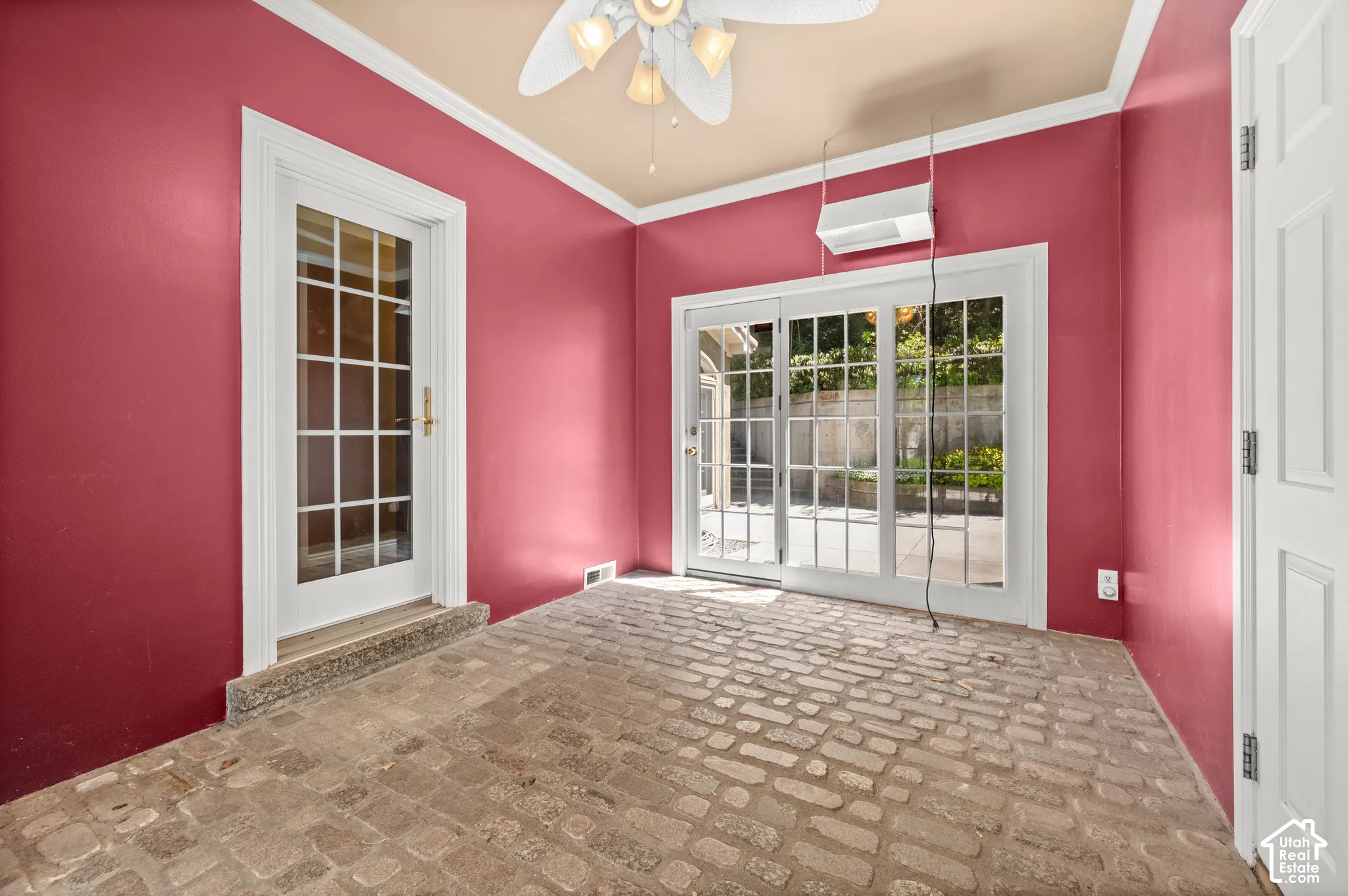 2 Exterior doors (to front and back) and entrance to 3 car garage