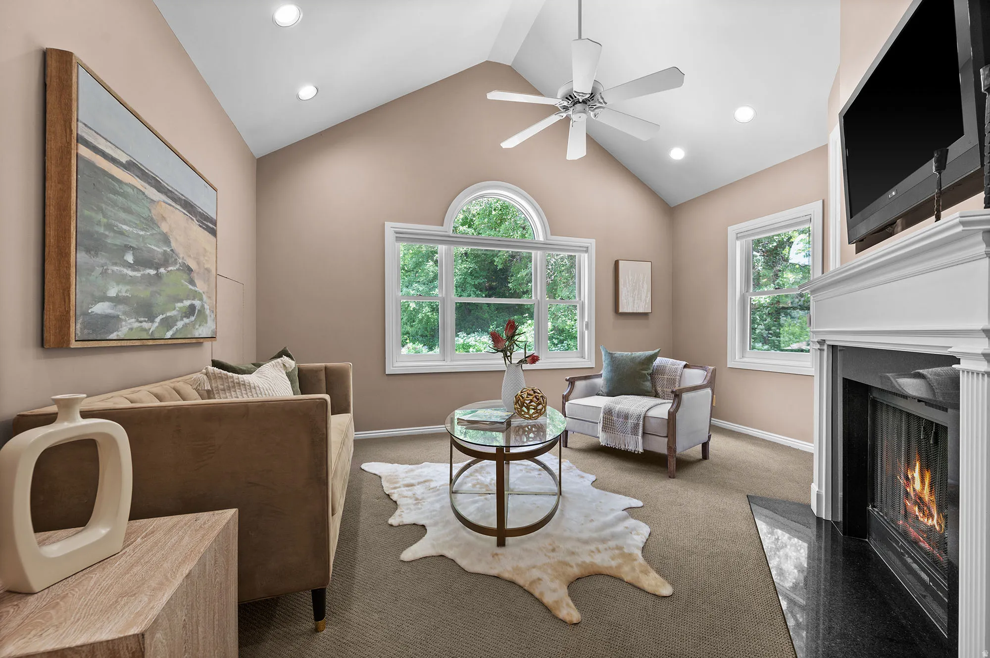 Private family room attached to the Primary bedroom, vaulted ceilings, with fireplace.