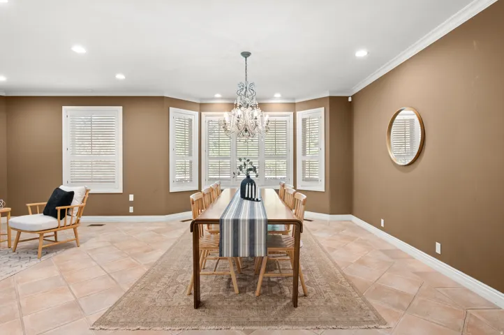 Dining room and suspended large chandelier.