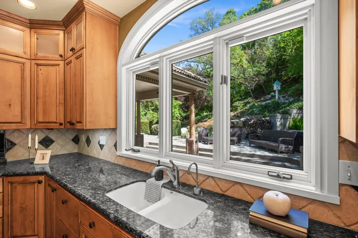 Kitchen window looking at fish pond and waterfall.