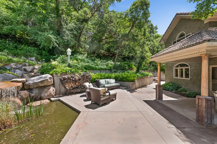 Patio, waterfall and fish pond