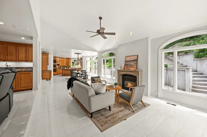 Vaulted ceilings complement the light-toned tile flooring throughout this open living space