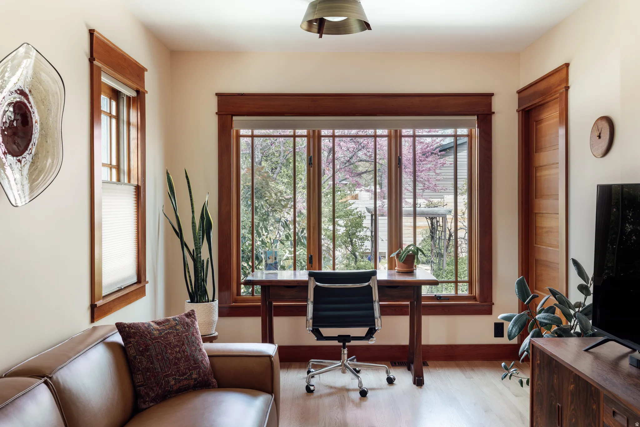 Office with wood finished floors and baseboards