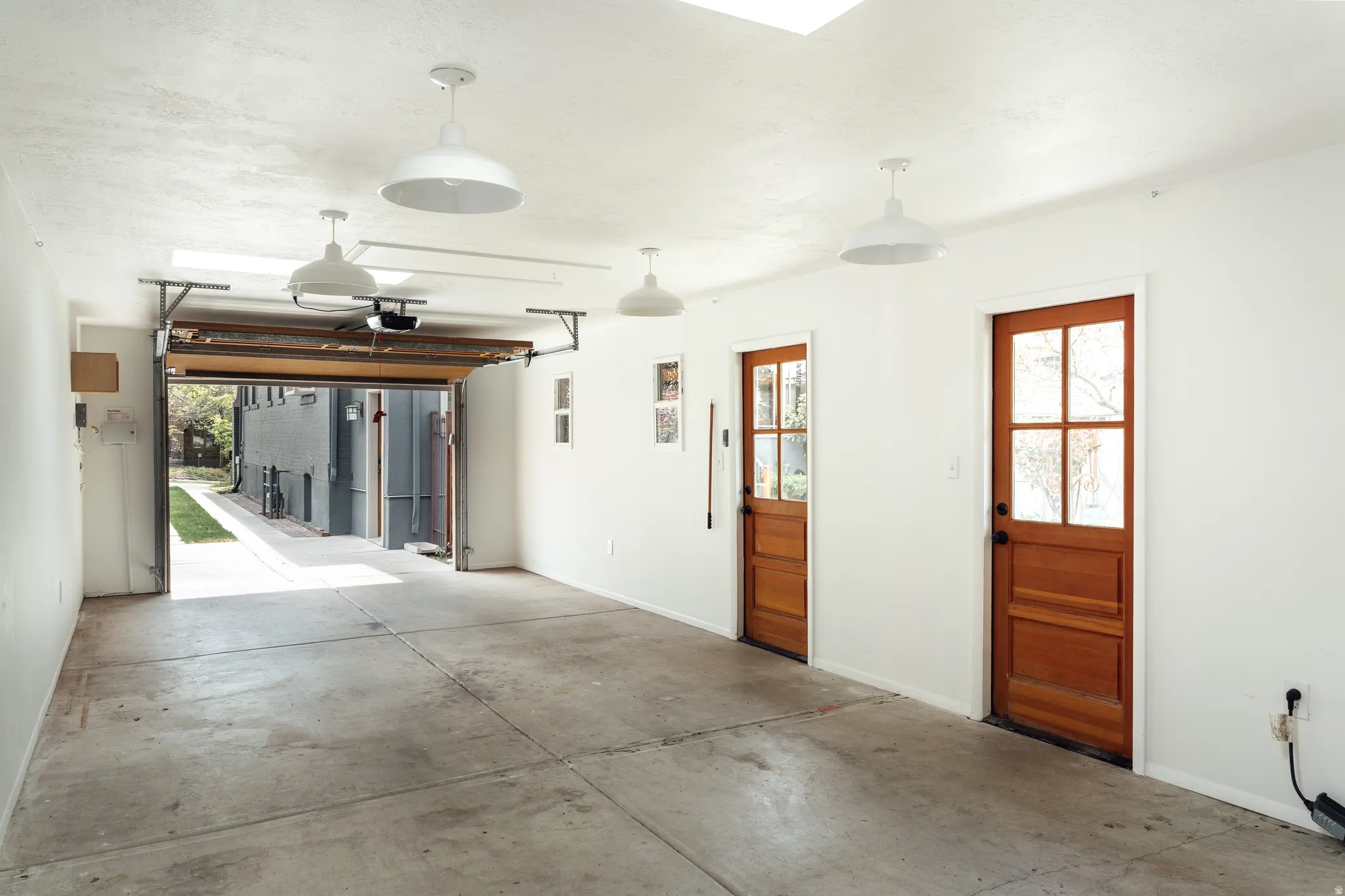 Garage featuring baseboards