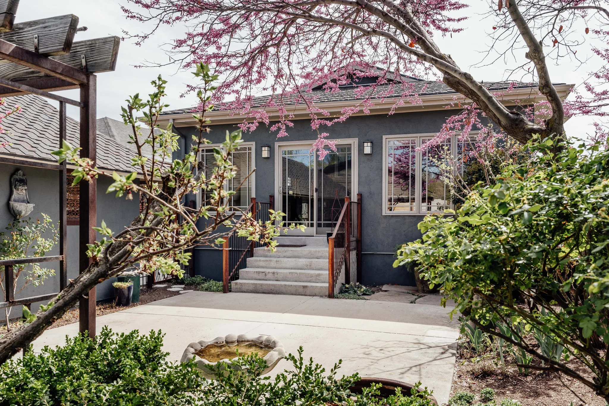 View of front of home with stucco siding and entry steps