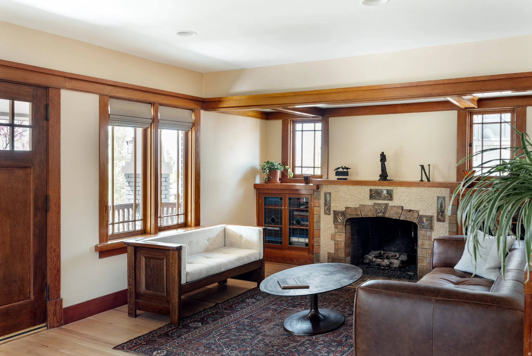Living room with wood finished floors and a fireplace