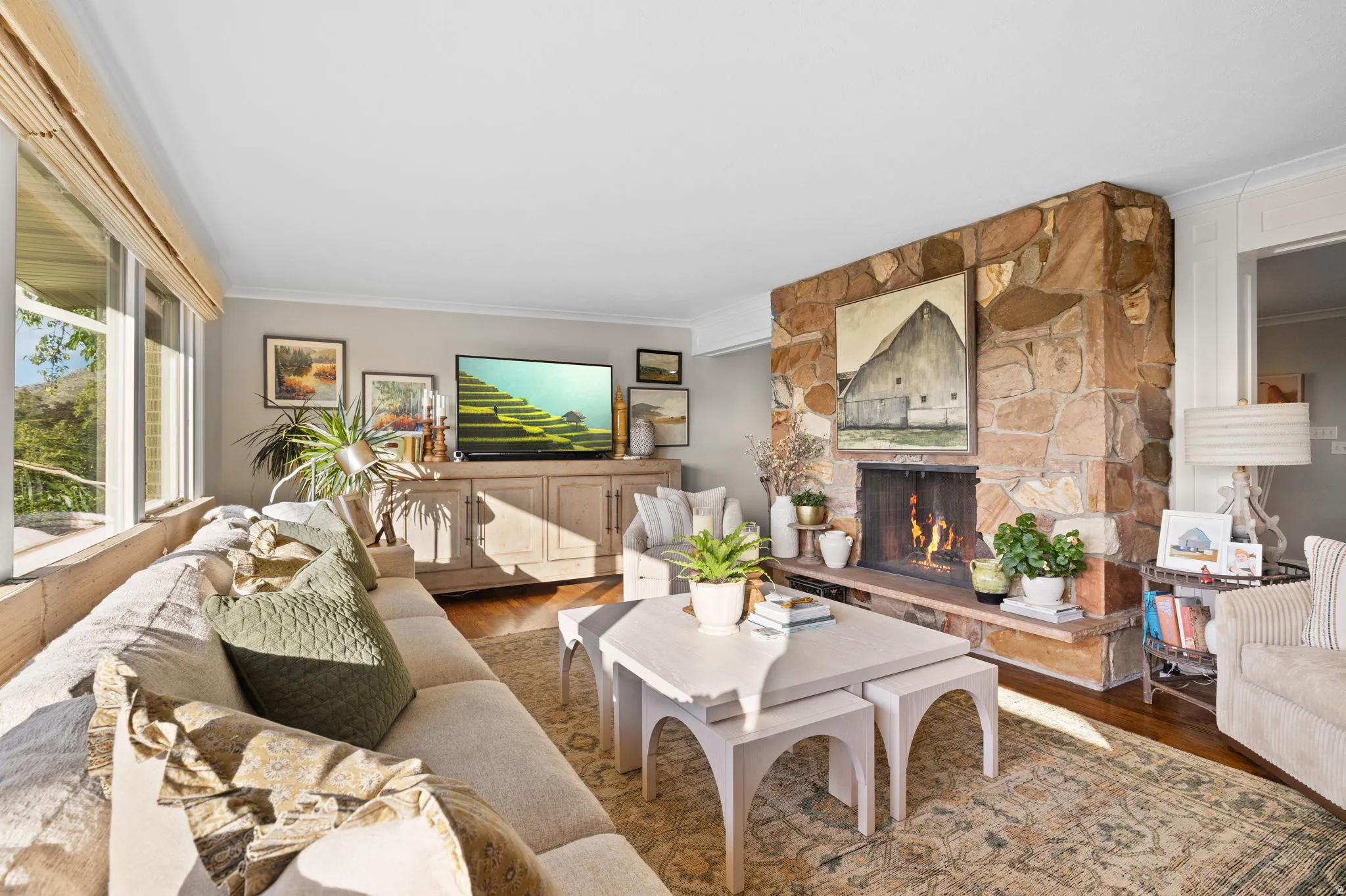 Living room featuring hardwood flooring, wood burning fireplace and views of Salt Lake valley