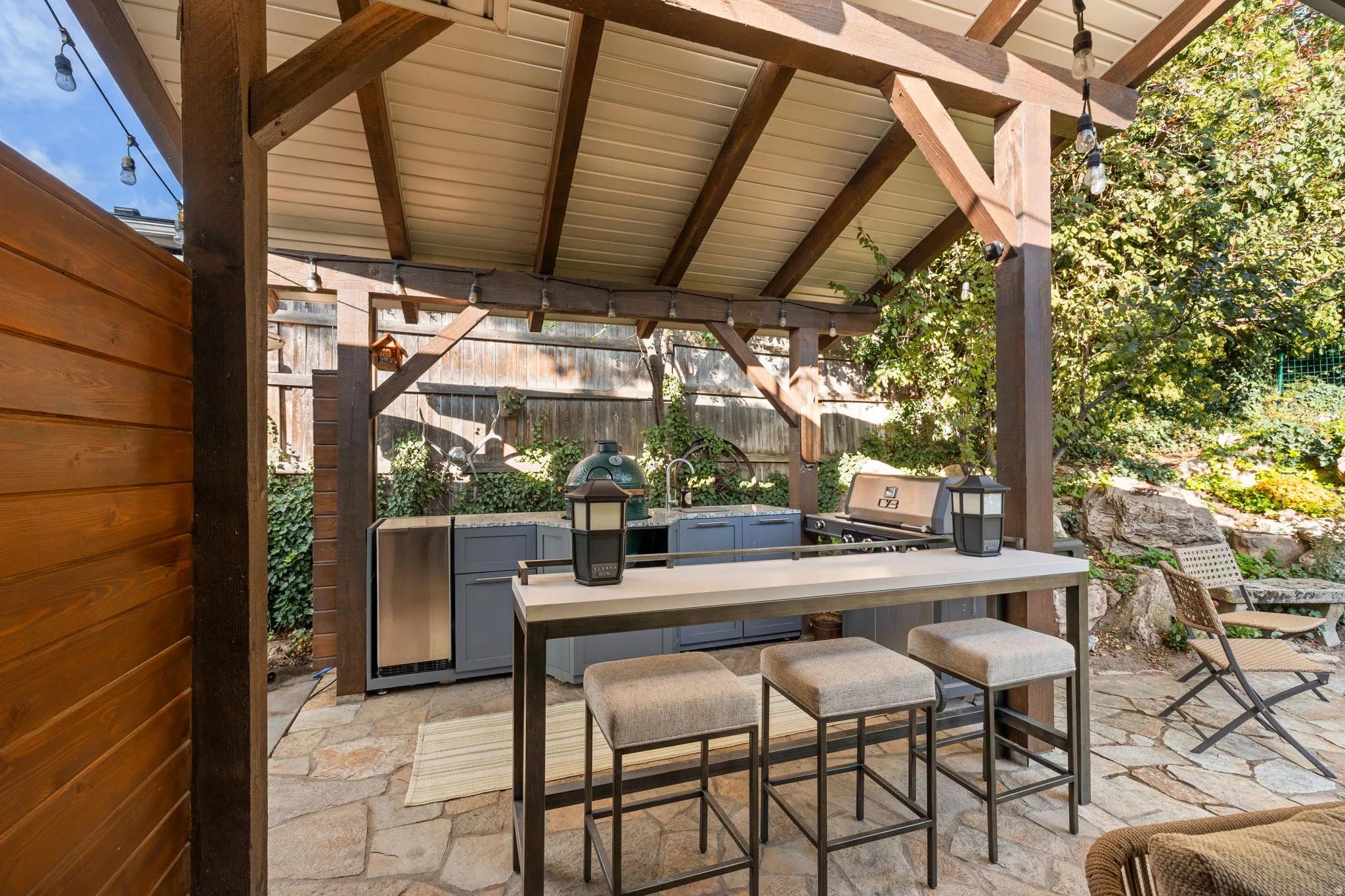 Backyard kitchenette with sink, ice maker and Green Egg cooker