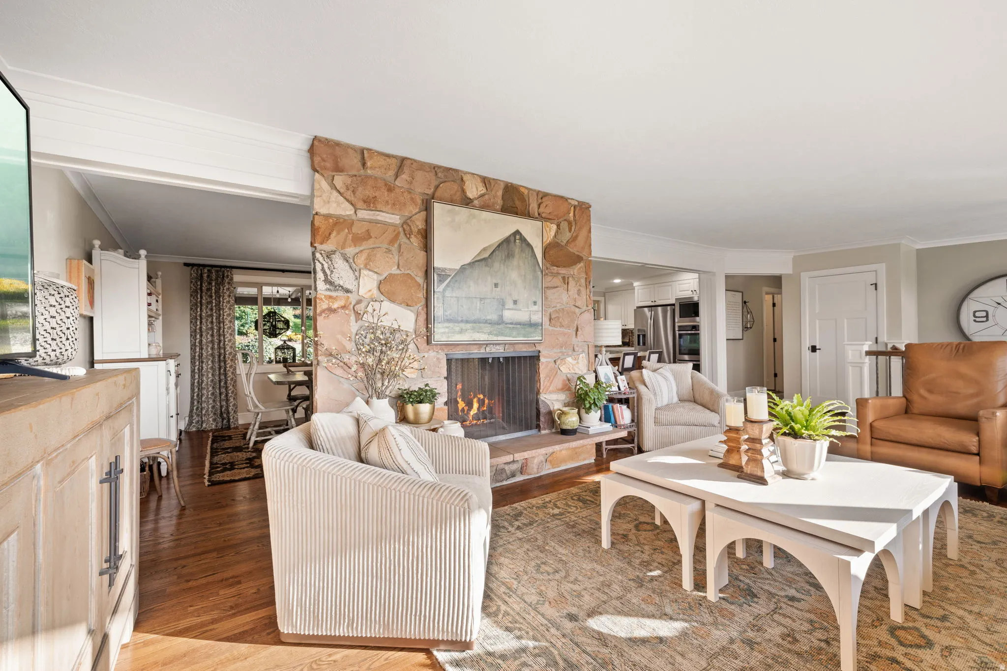 Living room featuring hardwood flooring, wood burning fireplace and views of Salt Lake valley