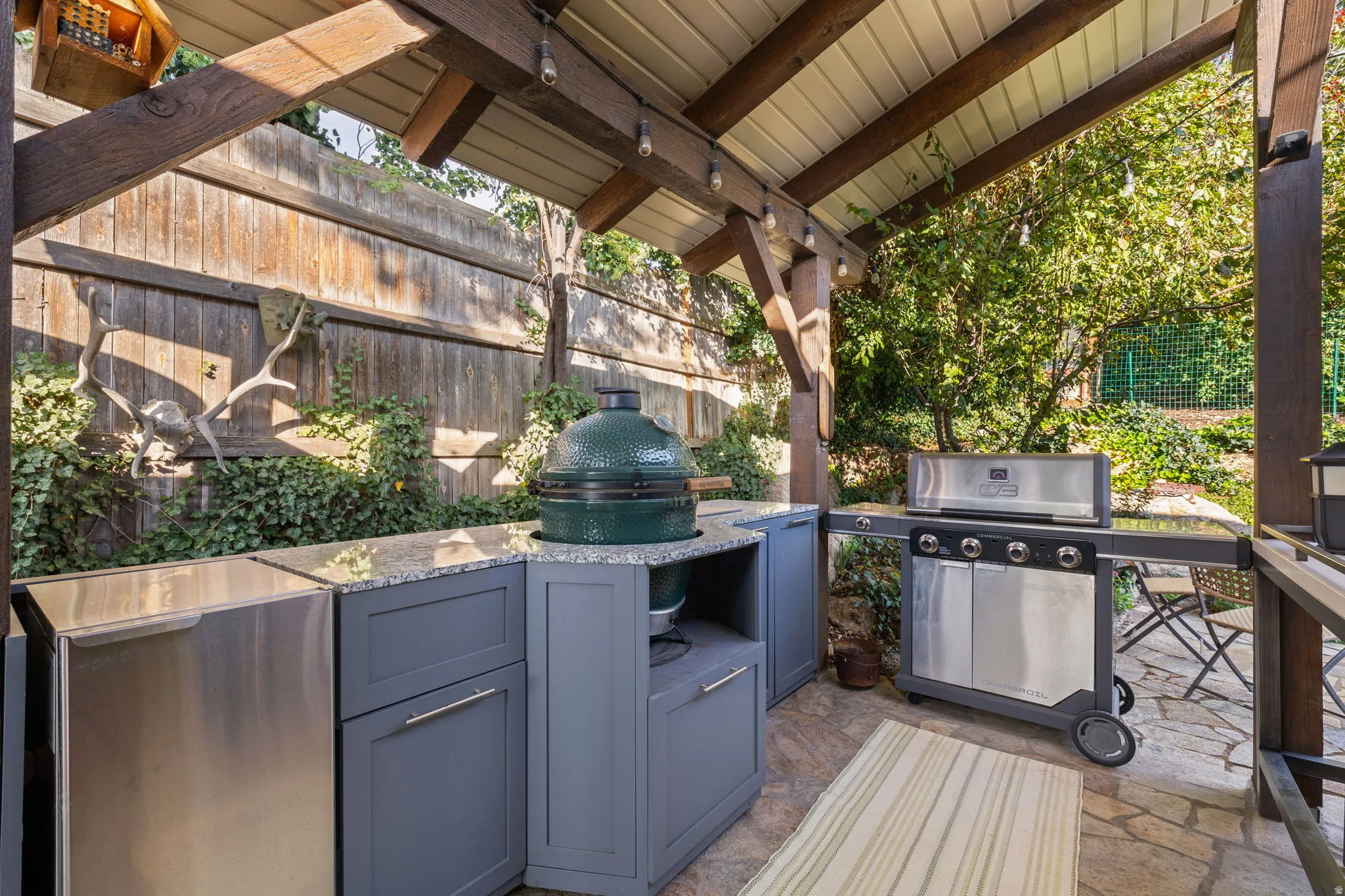 Backyard kitchenette with sink, ice maker and Green Egg cooker