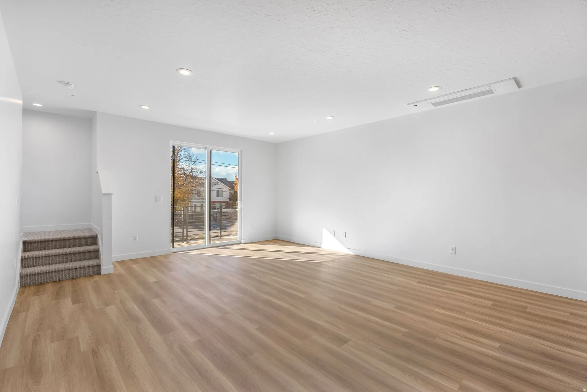 Photos are of a finished unit - Spare room featuring recessed lighting and light wood-style flooring