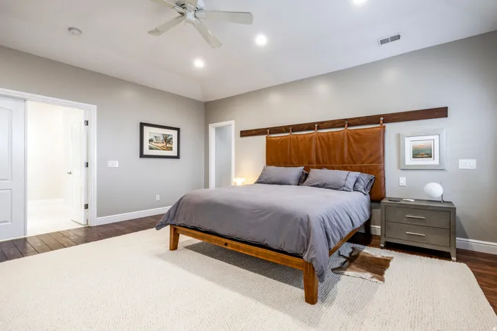 Bedroom with dark wood-style flooring, a ceiling fan, and recessed lighting