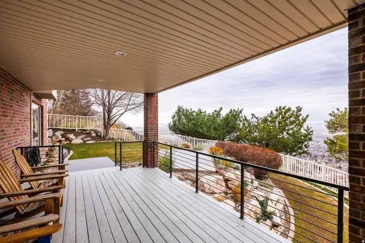 Wooden deck featuring a fenced backyard