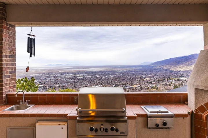 View of patio / terrace featuring exterior kitchen and a mountain view