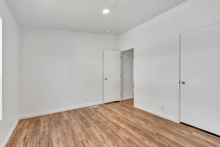 Unfurnished bedroom with light wood-style floors
