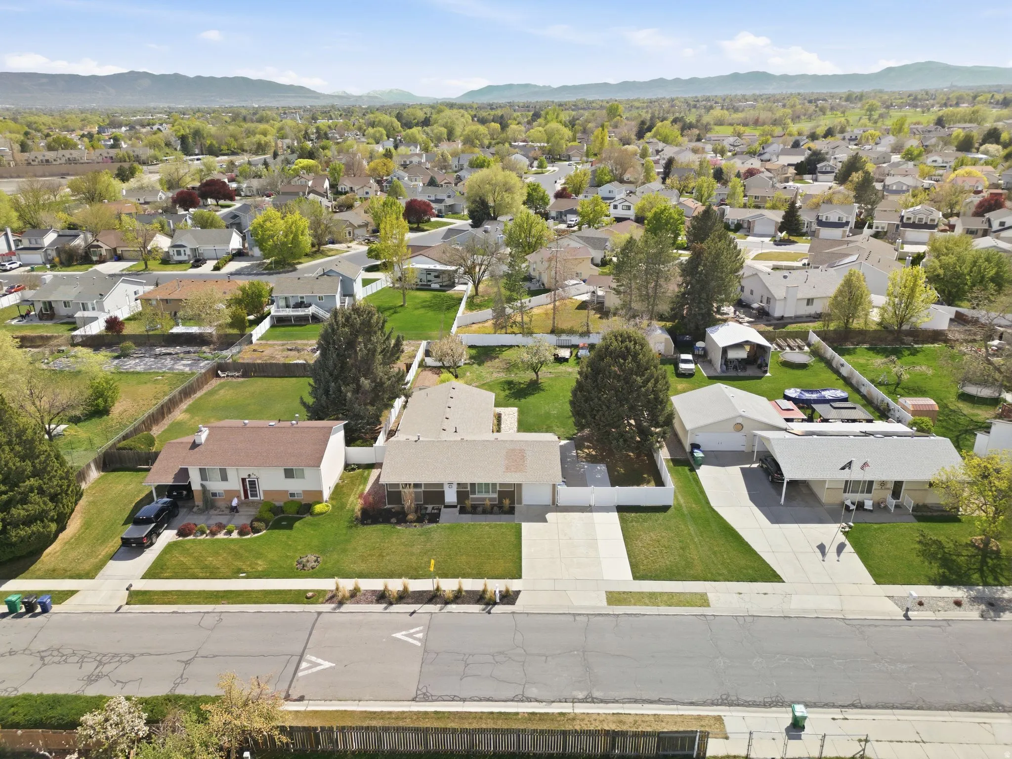 Aerial view of residential area featuring a mountainous background