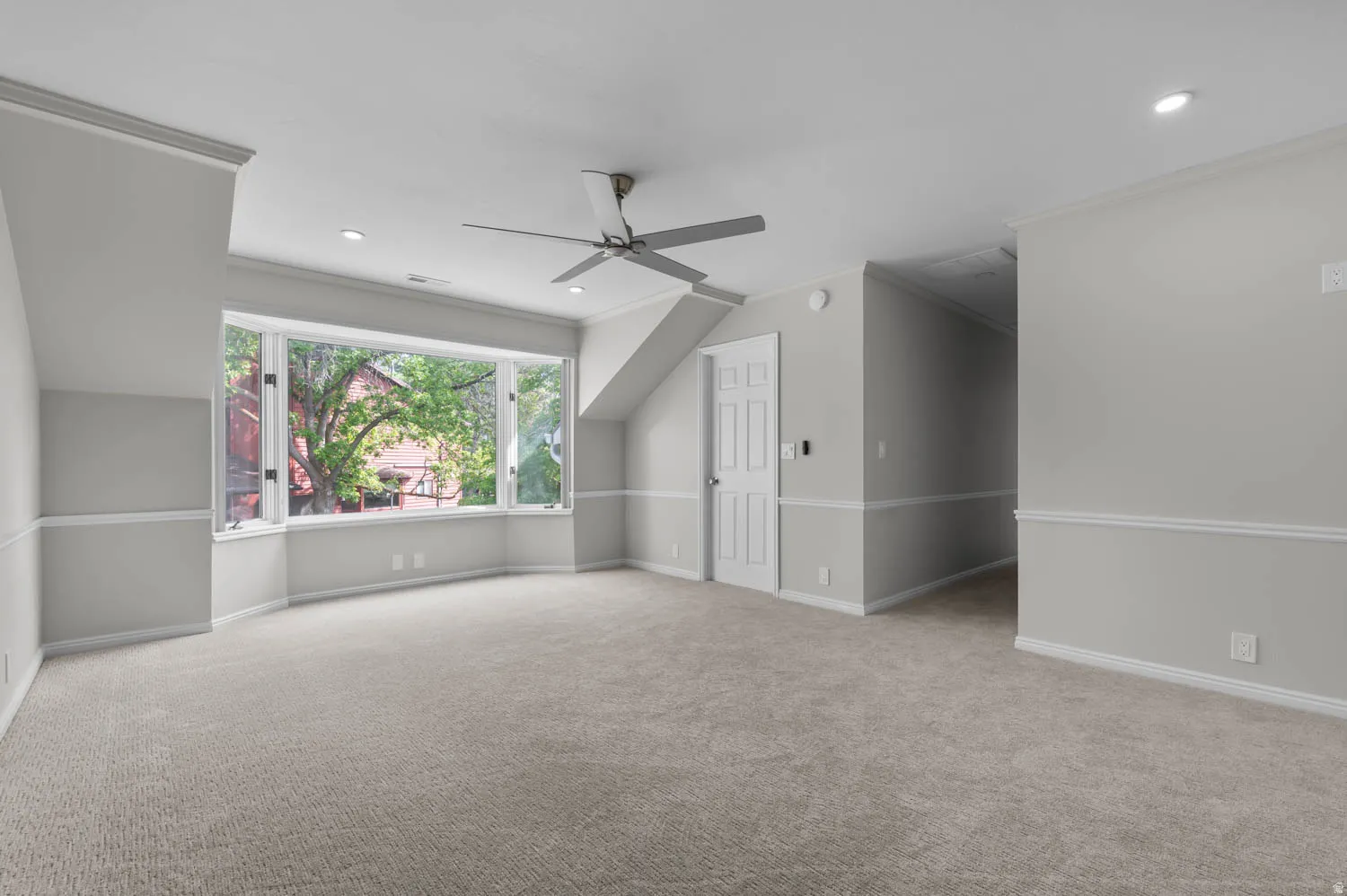 Bonus room with recessed lighting, a ceiling fan, light carpet, and lofted ceiling