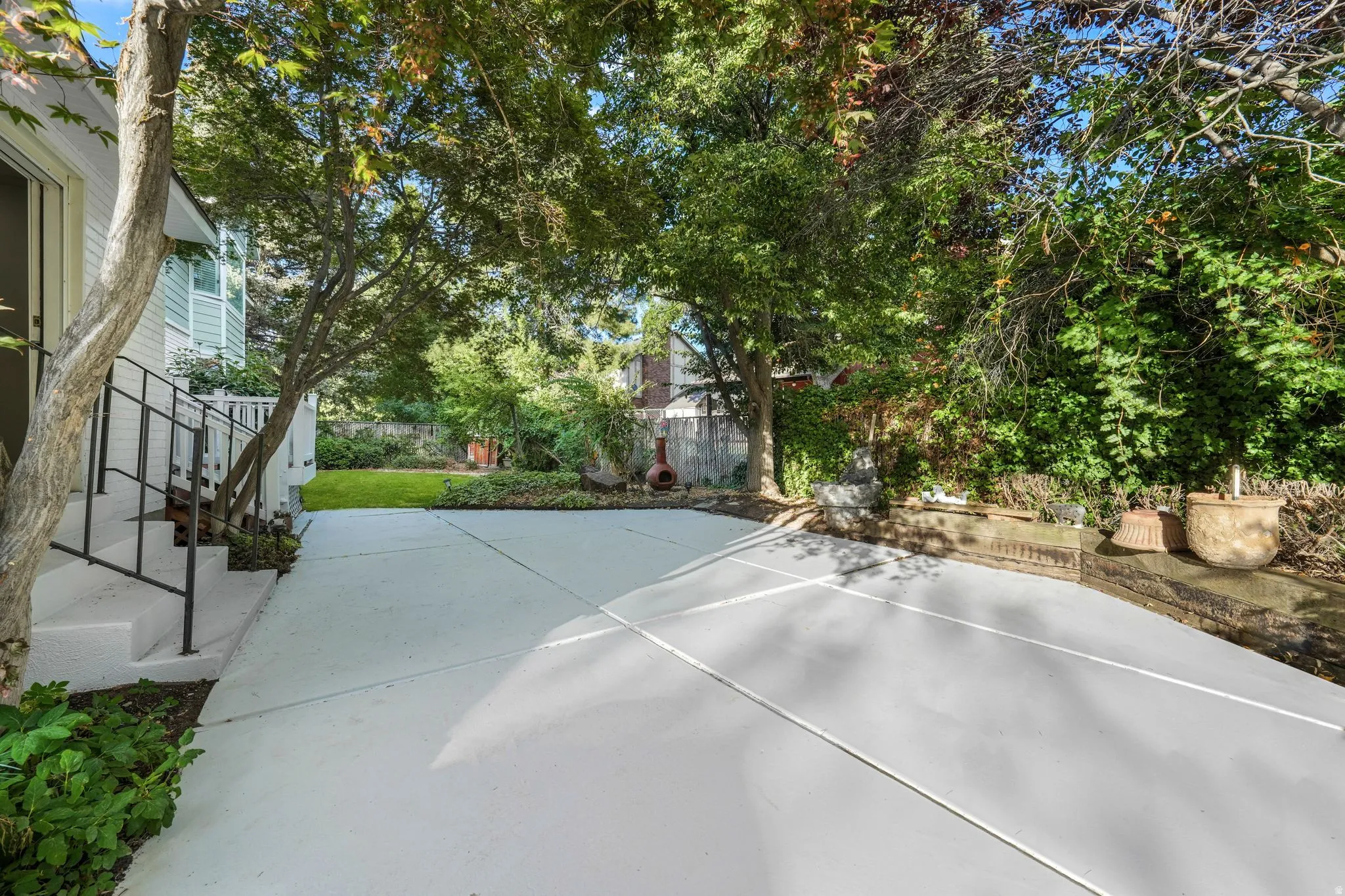 Fenced backyard featuring a patio