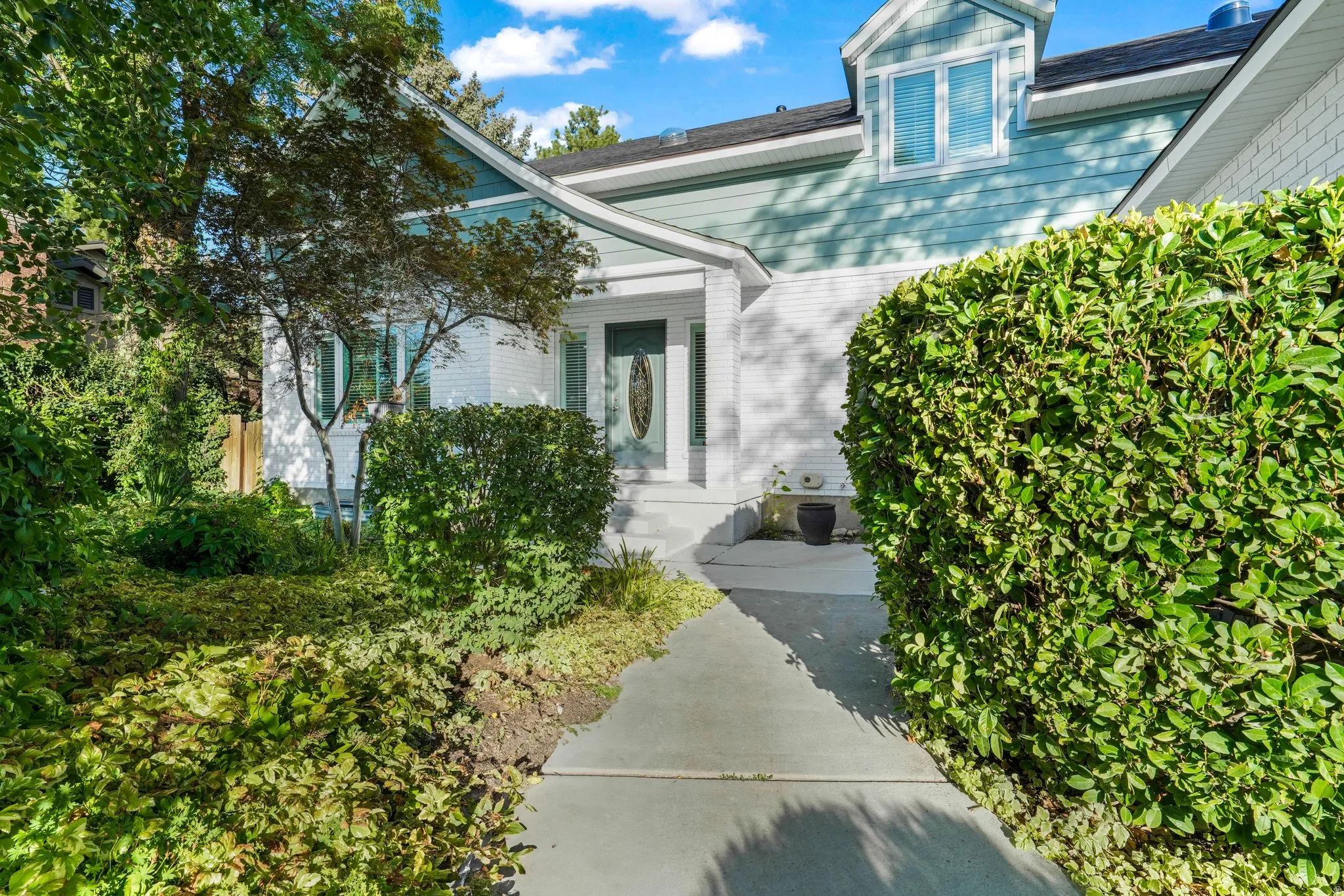 Entrance to property featuring brick siding