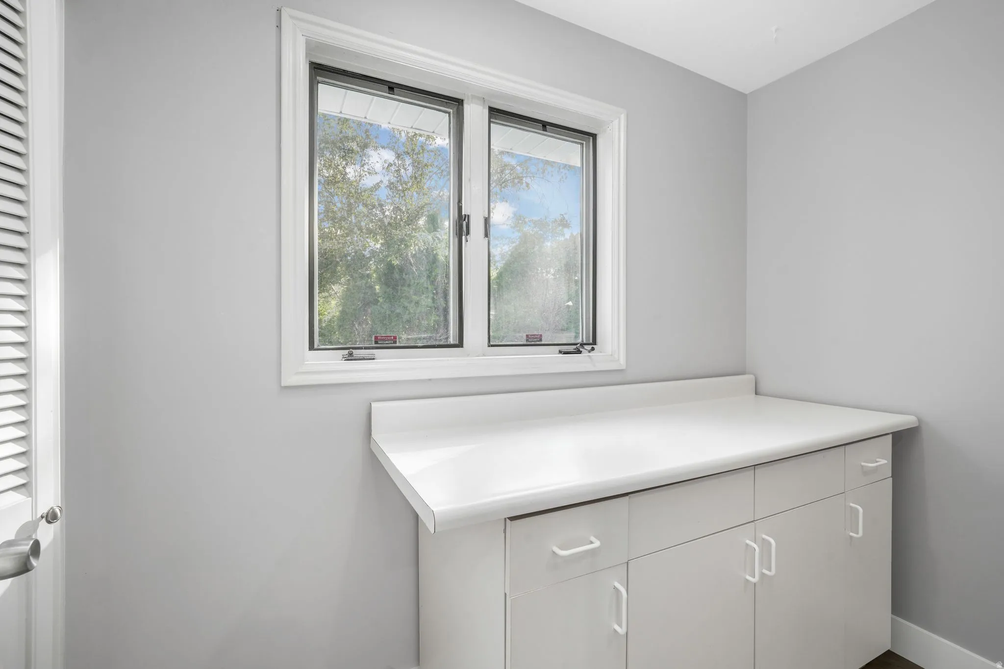 Bathroom featuring vanity and a closet